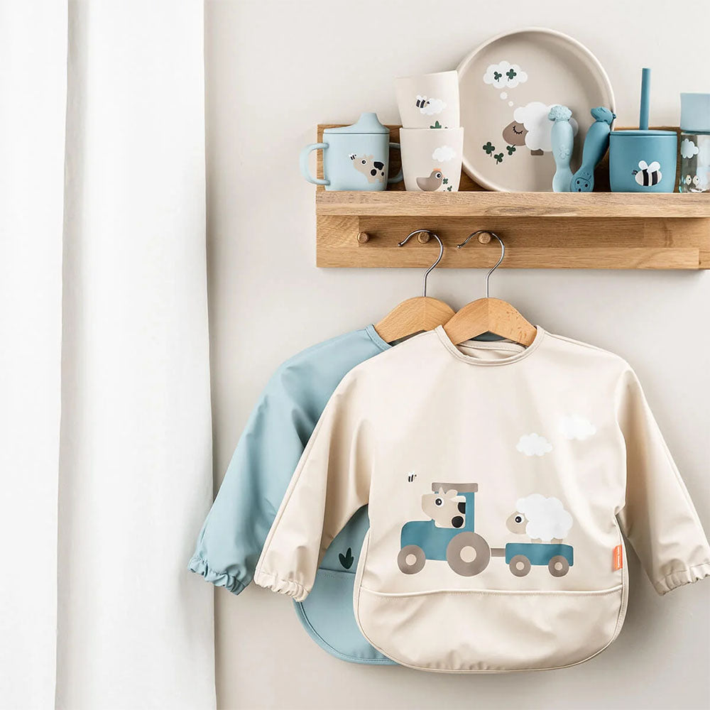 Babero grande con mangas y bolsillo Tiny Farm arena 6-18 meses